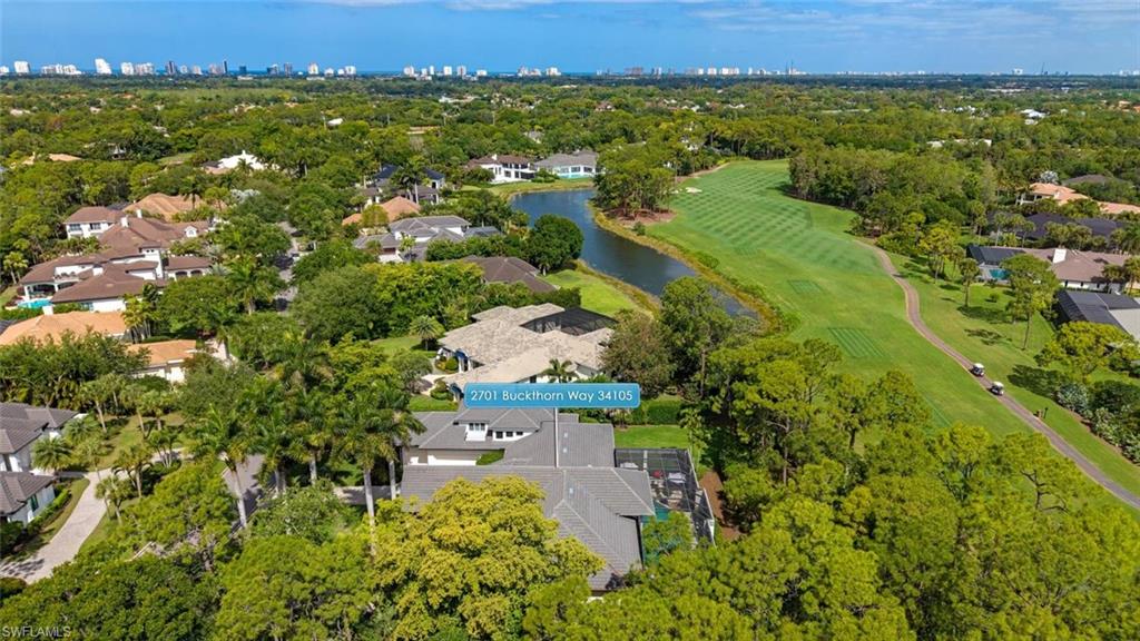 2701 Buckthorn Way Naples, FL 34105 - Photo 32 of 48 an aerial view of residential house with outdoor space and trees all around