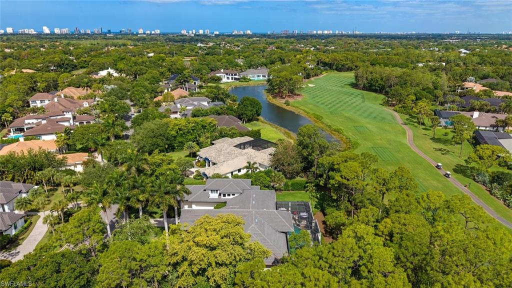 2701 Buckthorn Way Naples, FL 34105 - Photo 33 of 48 an aerial view of residential house with outdoor space and trees all around