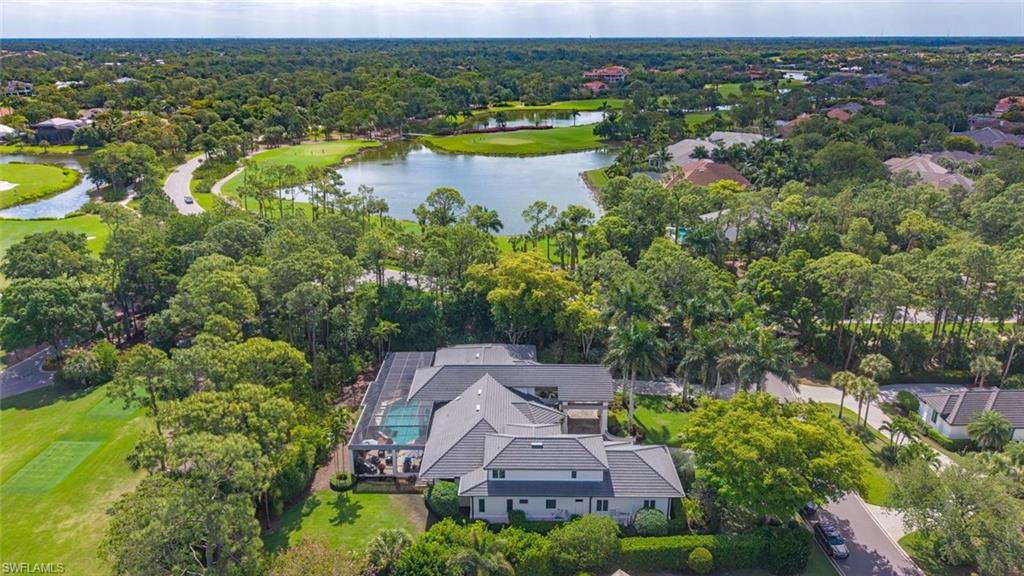 2701 Buckthorn Way Naples, FL 34105 - Photo 4 of 48 an aerial view of lake residential houses with outdoor space and swimming pool