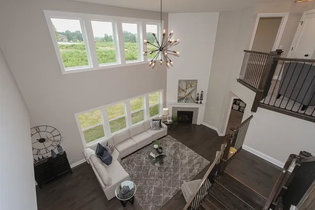 a living room with furniture flowerpot and a window