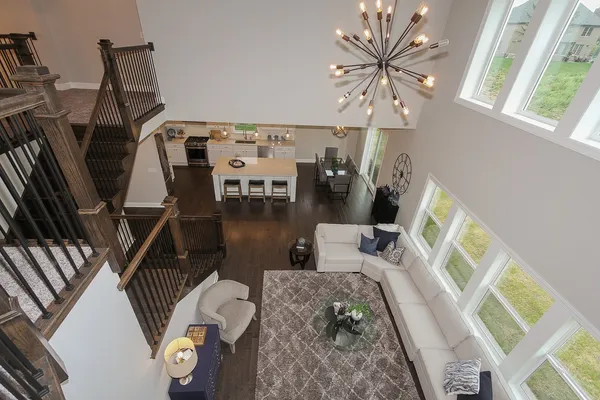 a living room with furniture and a floor to ceiling window