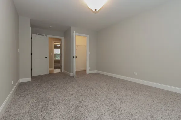 an empty room with closet area