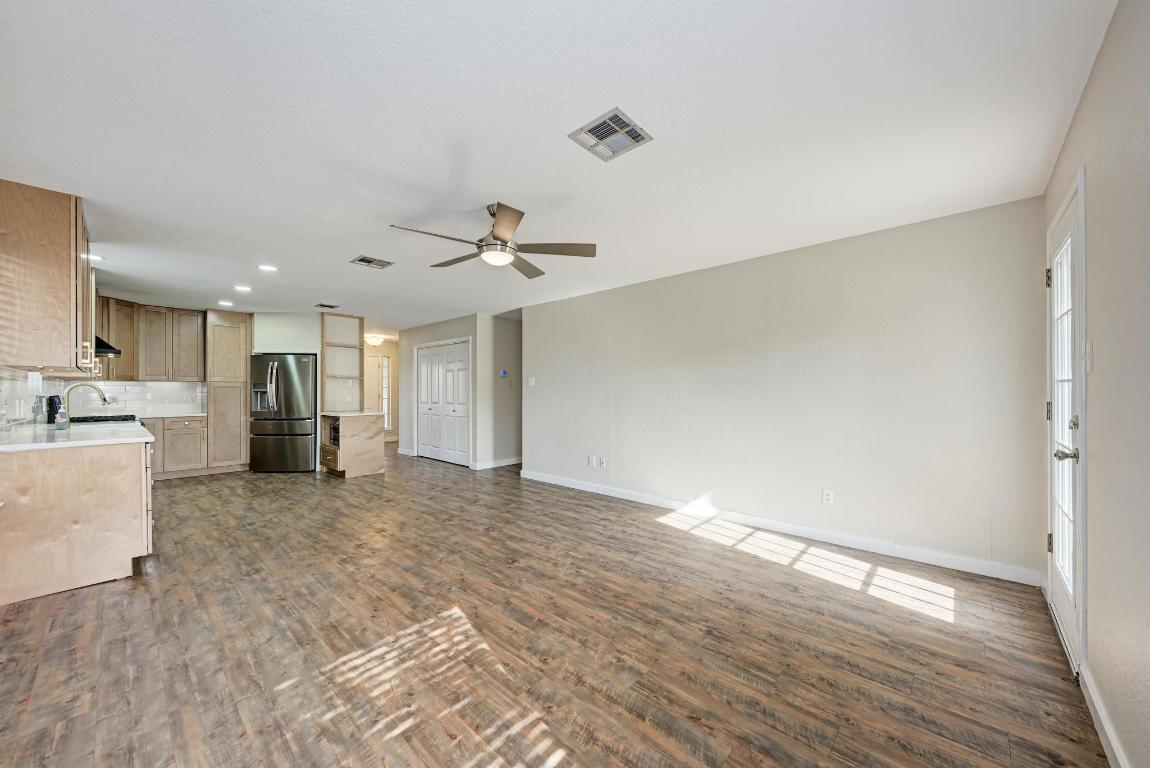 2317 Friarcreek Loop Round Rock, TX 78664 - Photo 15 of 36 a view of a kitchen with wooden floor and a sink