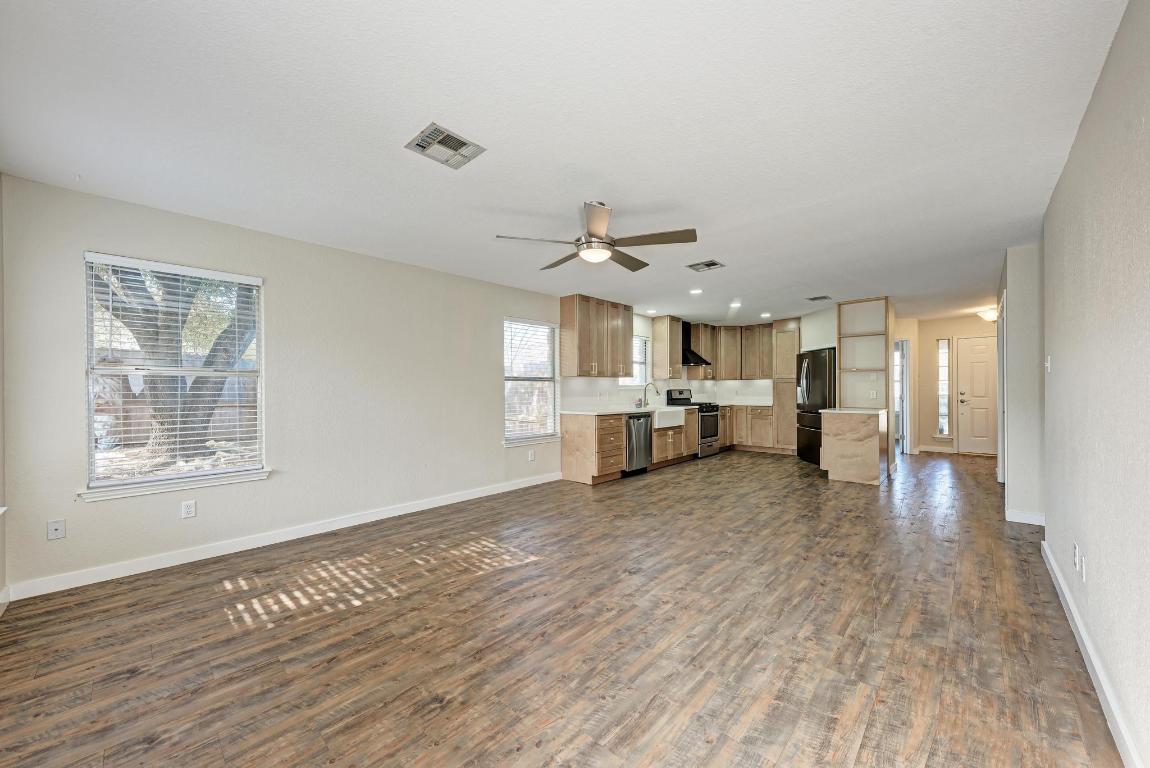 2317 Friarcreek Loop Round Rock, TX 78664 - Photo 16 of 36 a view of a kitchen with a sink and a window
