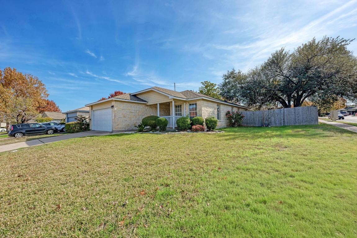 2317 Friarcreek Loop Round Rock, TX 78664 - Photo 2 of 36 a front view of house with yard and trees in the background
