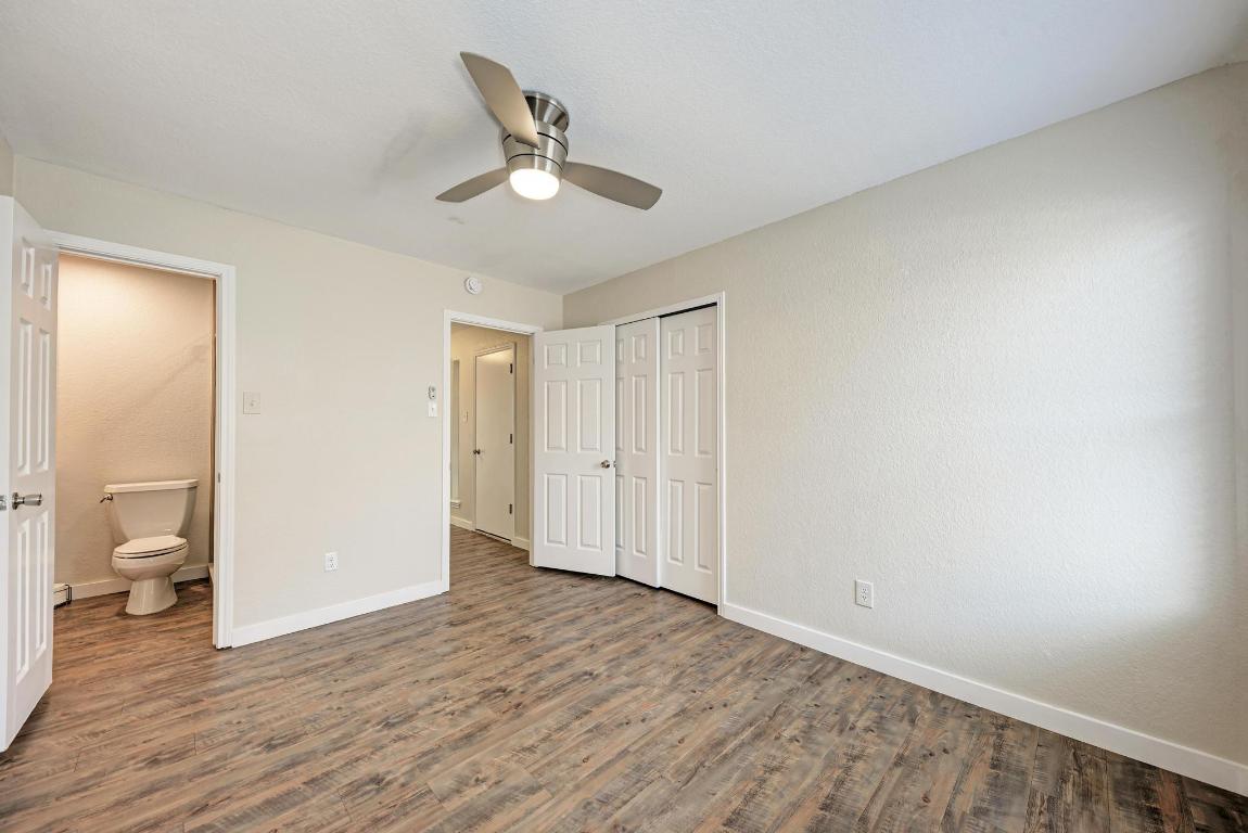 2317 Friarcreek Loop Round Rock, TX 78664 - Photo 25 of 36 an empty room with wooden floor and windows