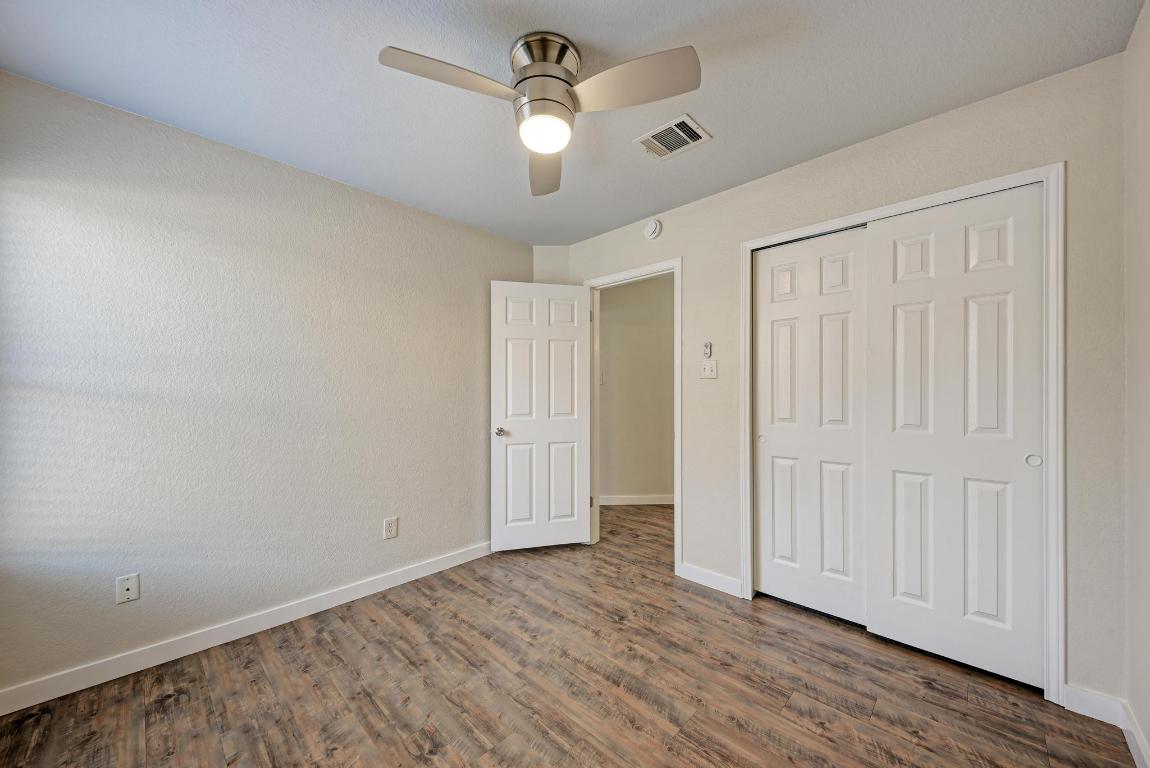 2317 Friarcreek Loop Round Rock, TX 78664 - Photo 28 of 36 an empty room with wooden floor ceiling fan