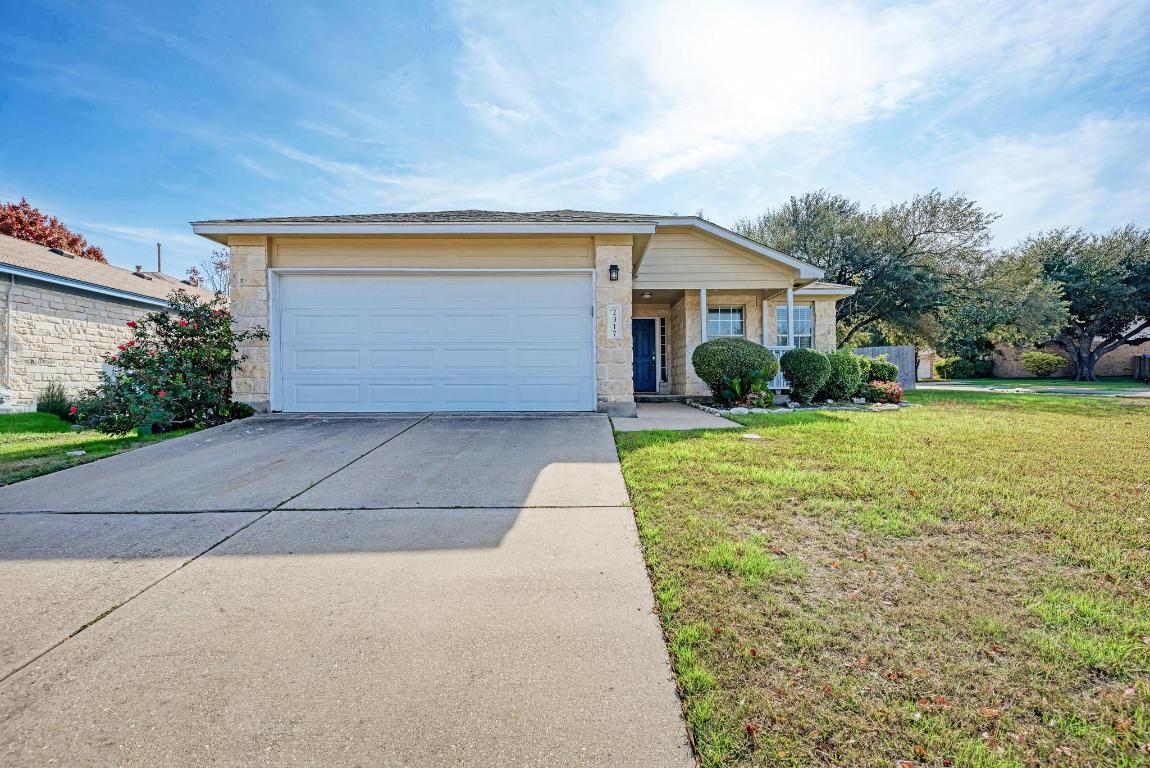 2317 Friarcreek Loop Round Rock, TX 78664 - Photo 3 of 36 a front view of house with yard