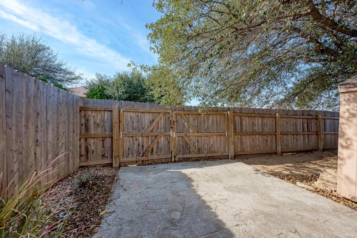 2317 Friarcreek Loop Round Rock, TX 78664 - Photo 32 of 36 a view of backyard with wooden fence