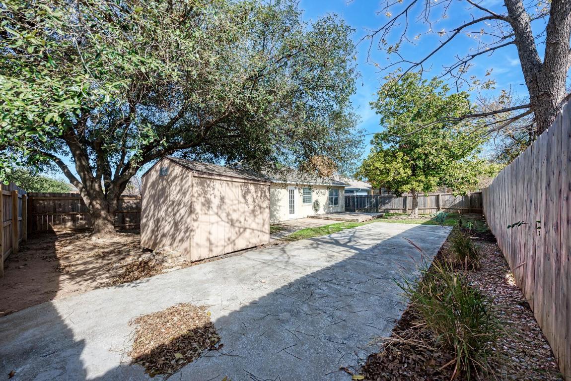2317 Friarcreek Loop Round Rock, TX 78664 - Photo 33 of 36 a view of a yard with plants and trees
