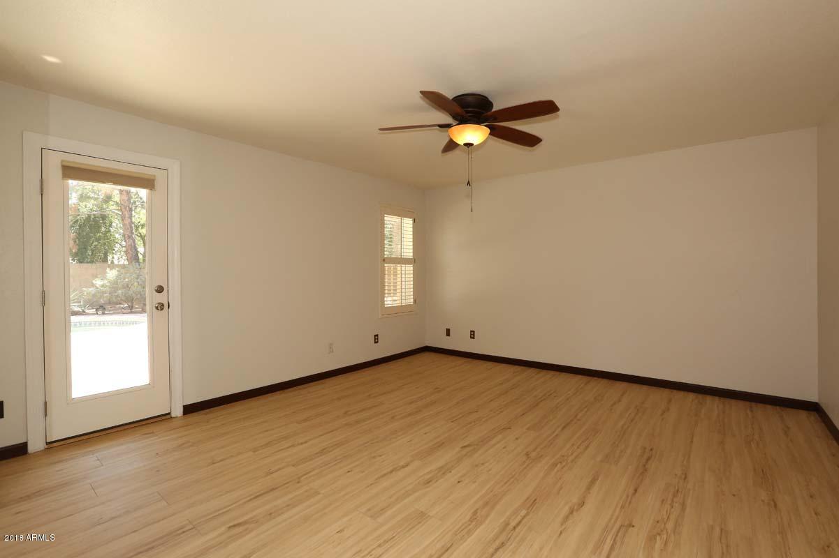 5109 East Kathleen Road Scottsdale, AZ 85254 - Photo 2 of 54 a view of empty room with wooden floor and fan