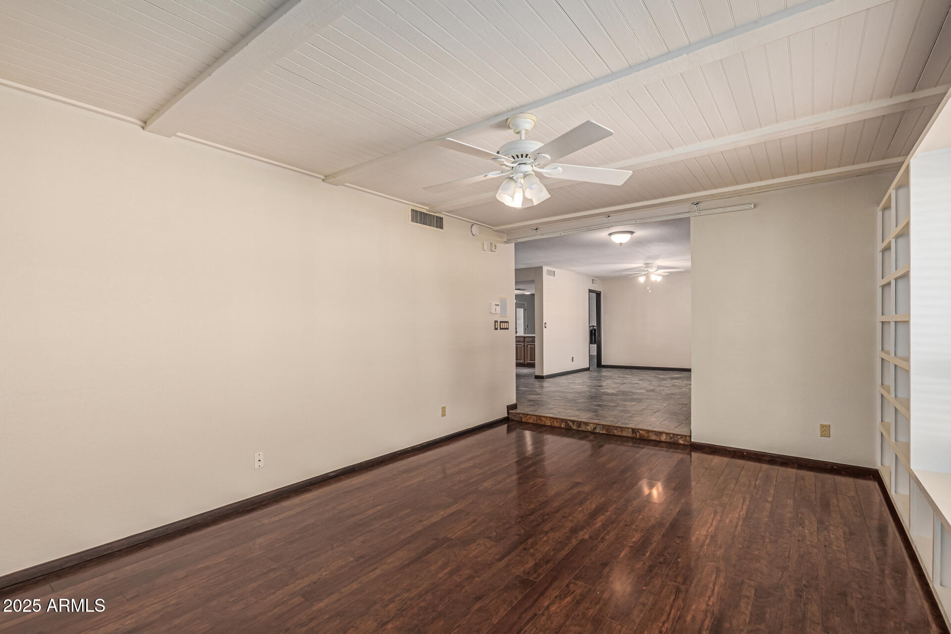 5109 East Kathleen Road Scottsdale, AZ 85254 - Photo 26 of 54 an empty room with wooden floor and ceiling fan