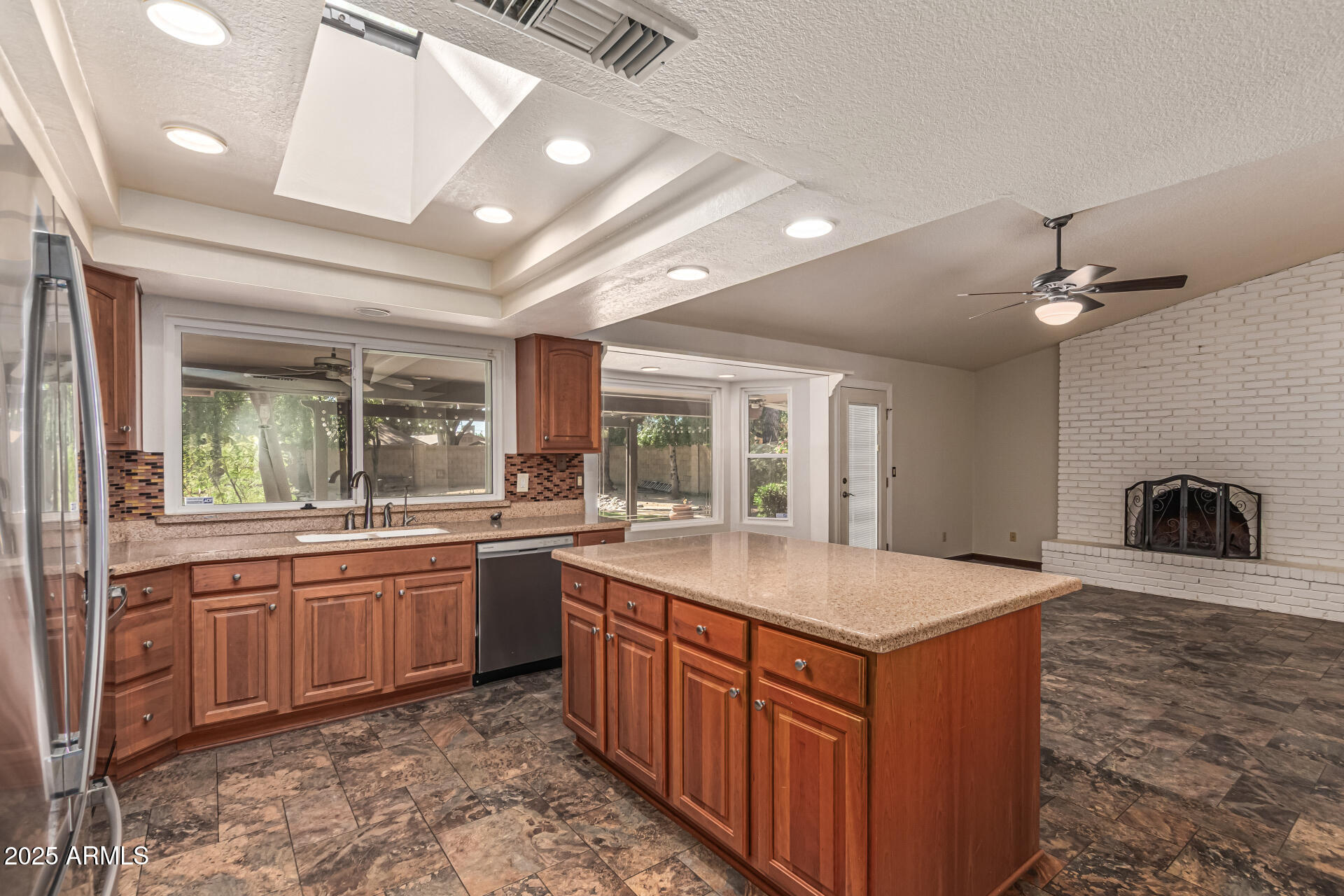 5109 East Kathleen Road Scottsdale, AZ 85254 - Photo 30 of 54 a kitchen with stainless steel appliances granite countertop a sink a stove and a refrigerator