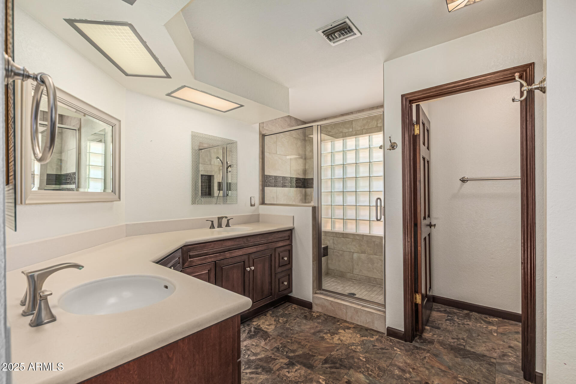 5109 East Kathleen Road Scottsdale, AZ 85254 - Photo 36 of 54 a bathroom with a double vanity sink mirror and shower
