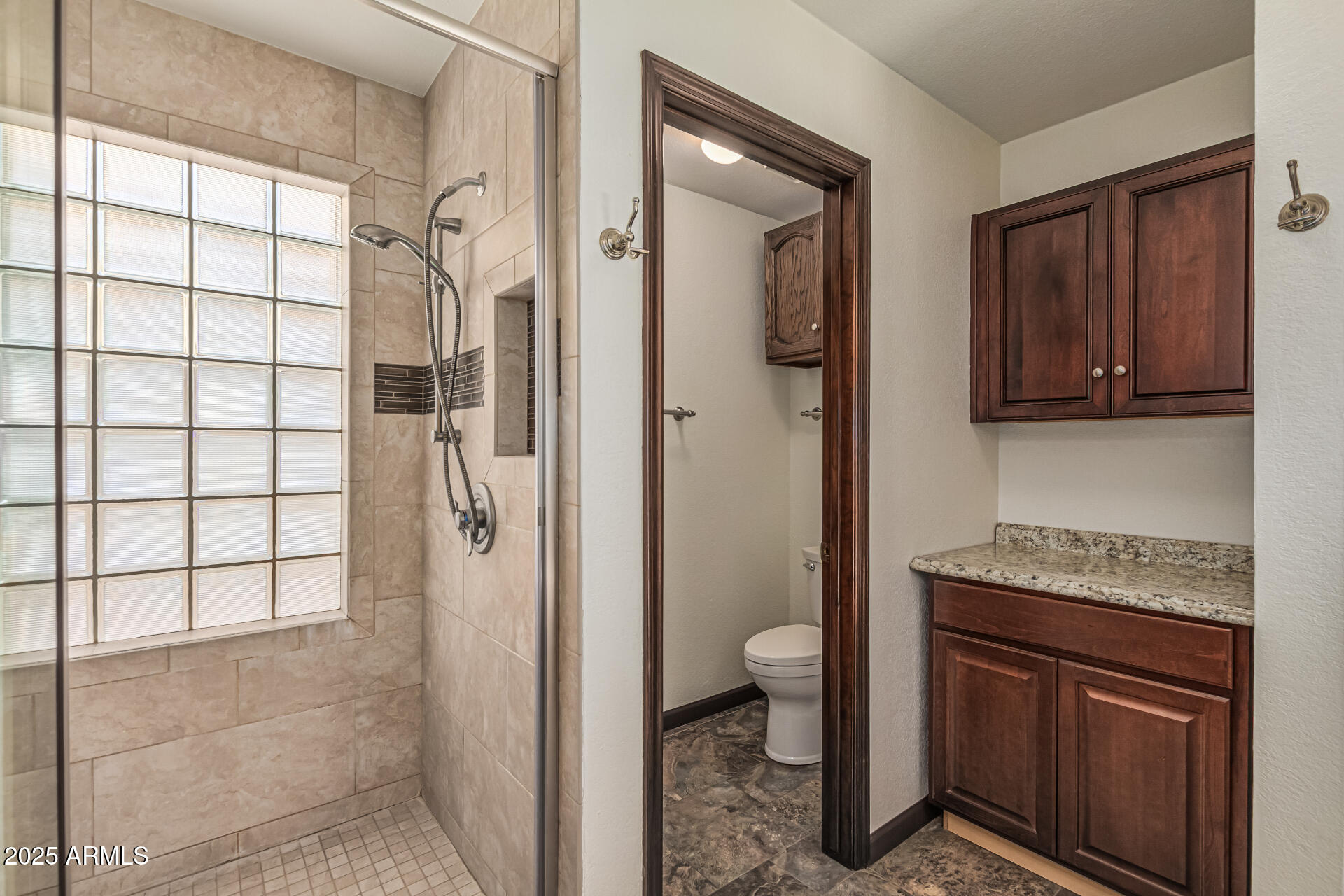 5109 East Kathleen Road Scottsdale, AZ 85254 - Photo 38 of 54 a bathroom with a granite countertop sink a toilet and shower