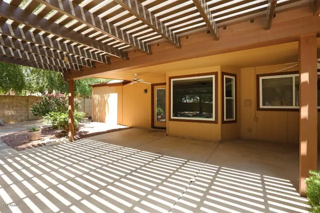 a view of a backyard with large trees