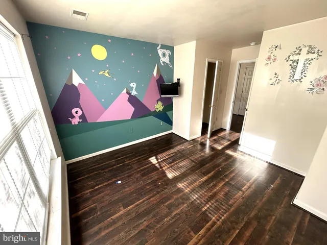 a view of a floor to ceiling window and wooden floor