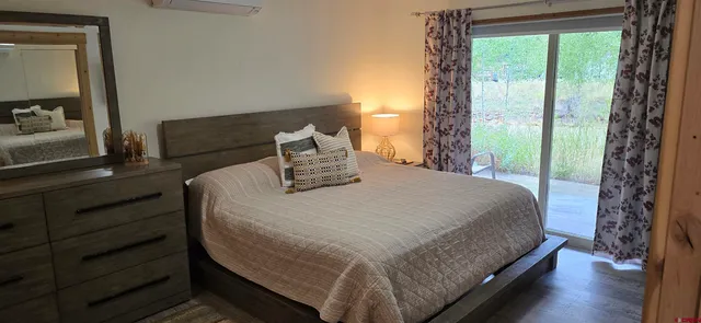 a bathroom with a double vanity sink and mirror