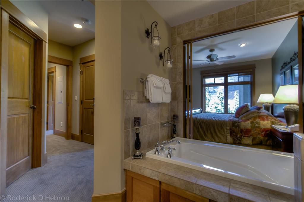 280 Trailhead Drive, Unit 3043 Keystone, CO 80435 - Photo 12 of 24 a bedroom with a bed and a dresser