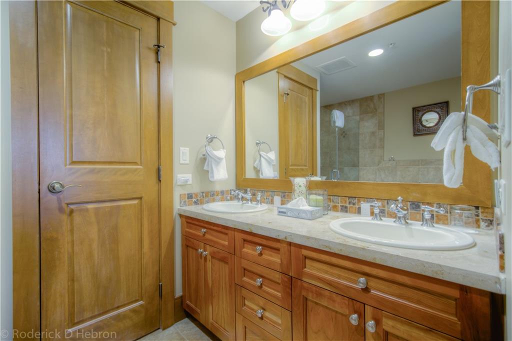 280 Trailhead Drive, Unit 3043 Keystone, CO 80435 - Photo 14 of 24 a bathroom with a double vanity sink and a mirror