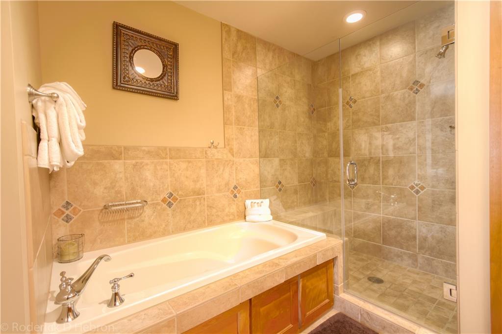 280 Trailhead Drive, Unit 3043 Keystone, CO 80435 - Photo 15 of 24 a bathroom with a tub and a shower