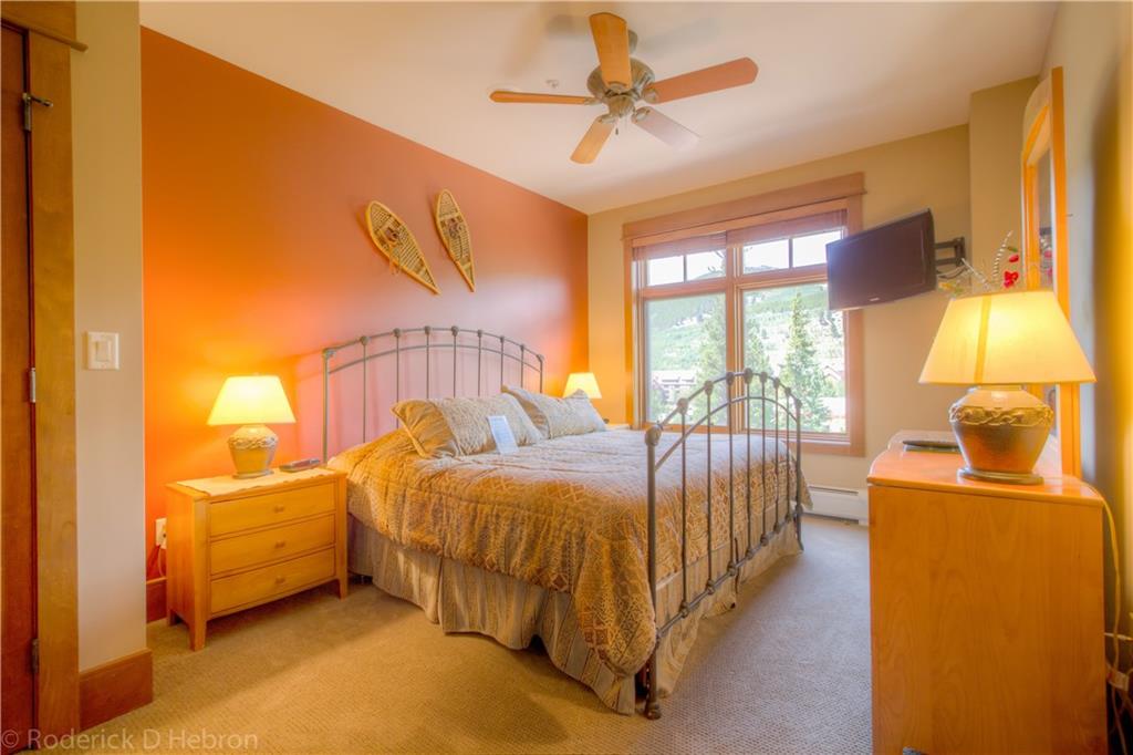 280 Trailhead Drive, Unit 3043 Keystone, CO 80435 - Photo 16 of 24 a bedroom with a bed and a chandelier