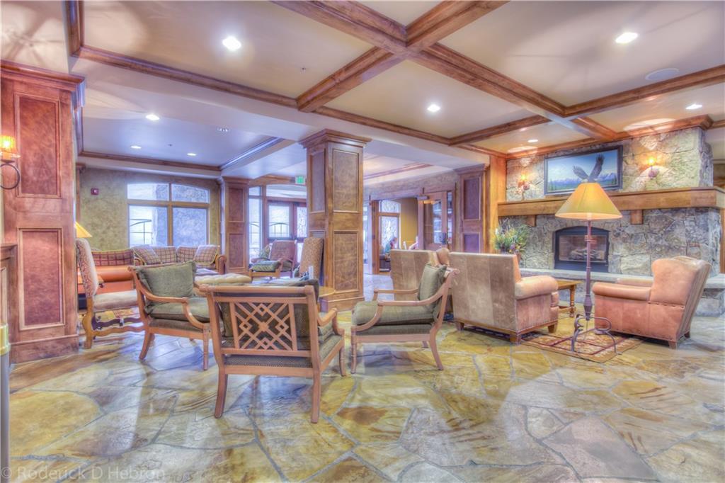 280 Trailhead Drive, Unit 3043 Keystone, CO 80435 - Photo 21 of 24 a living room with furniture and a fireplace