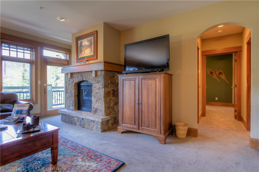 280 Trailhead Drive, Unit 3043 Keystone, CO 80435 - Photo 4 of 24 a living room with furniture and a fireplace
