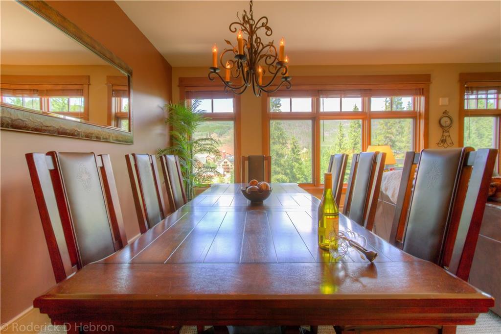 280 Trailhead Drive, Unit 3043 Keystone, CO 80435 - Photo 5 of 24 a view of a dining room with furniture a chandelier and wooden floor