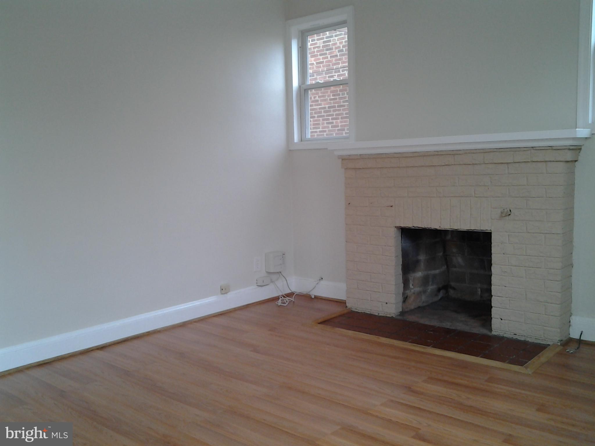 Living Room w/ Wood Burning Fireplace