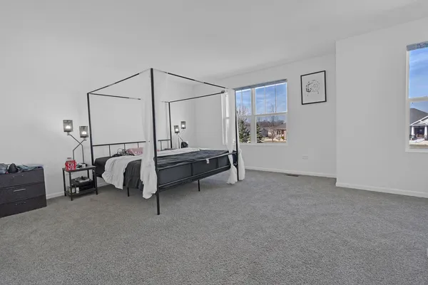 a bed room with furniture and window