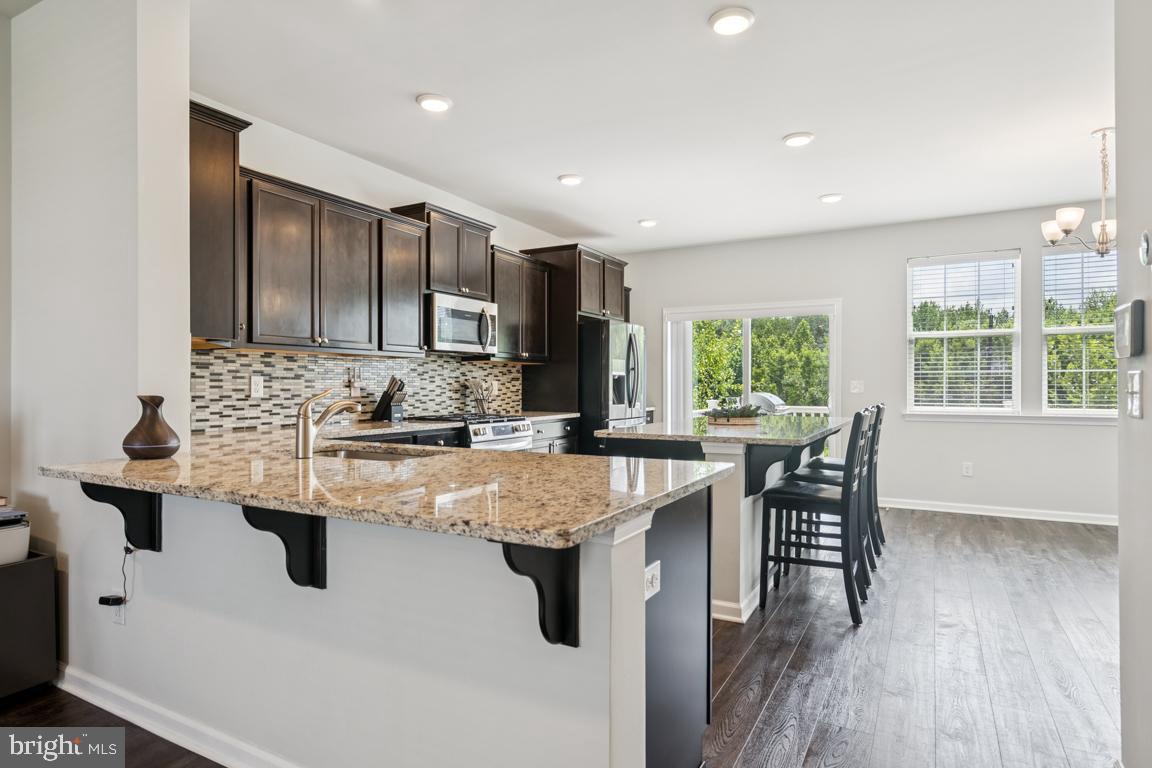 16 Naples Lane Mount Laurel, NJ 08054 - Photo 10 of 30 a kitchen with kitchen island granite countertop a sink and stove
