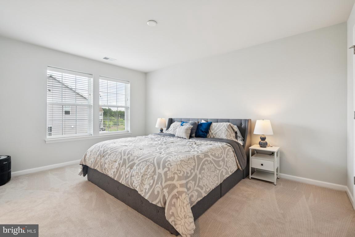 16 Naples Lane Mount Laurel, NJ 08054 - Photo 16 of 30 a bed sitting in a bedroom next to a window