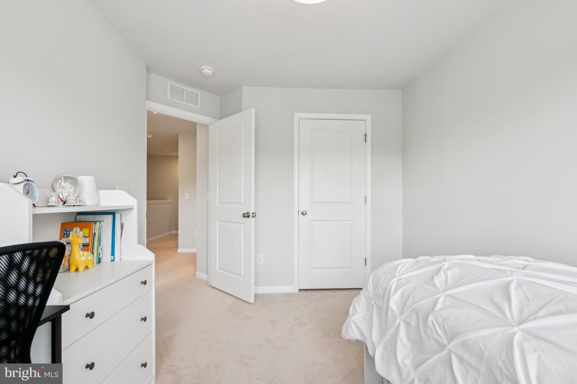 16 Naples Lane Mount Laurel, NJ 08054 - Photo 23 of 30 a bedroom with a bed and wooden floor