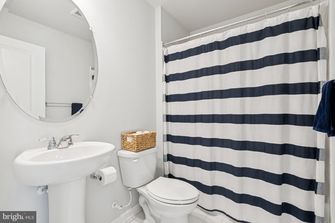 16 Naples Lane Mount Laurel, NJ 08054 - Photo 7 of 30 a white toilet sitting next to a bathroom sink