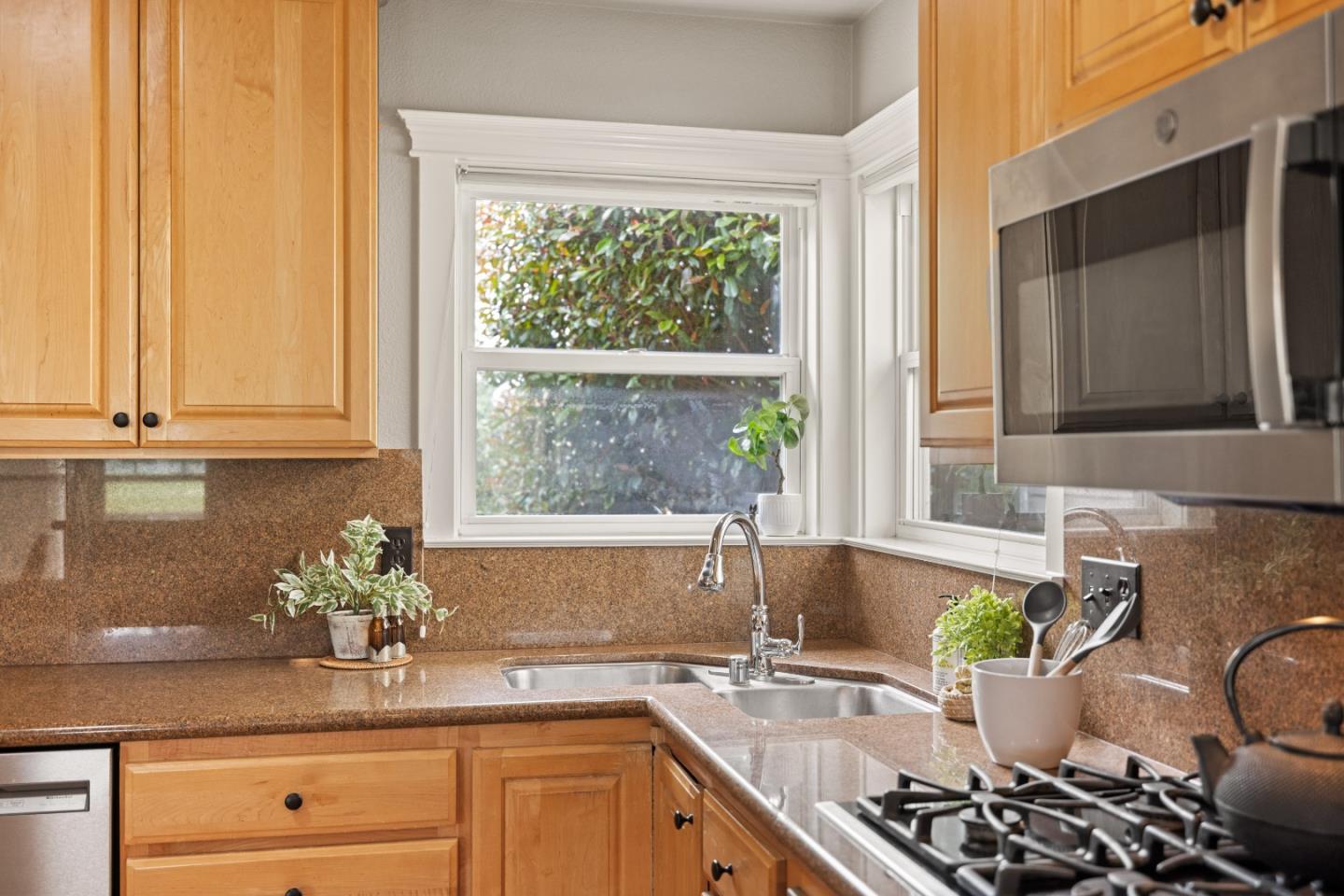 2549 Colonial Circle Watsonville, CA 95076 - Photo 15 of 54 a kitchen with a window a sink and white cabinets