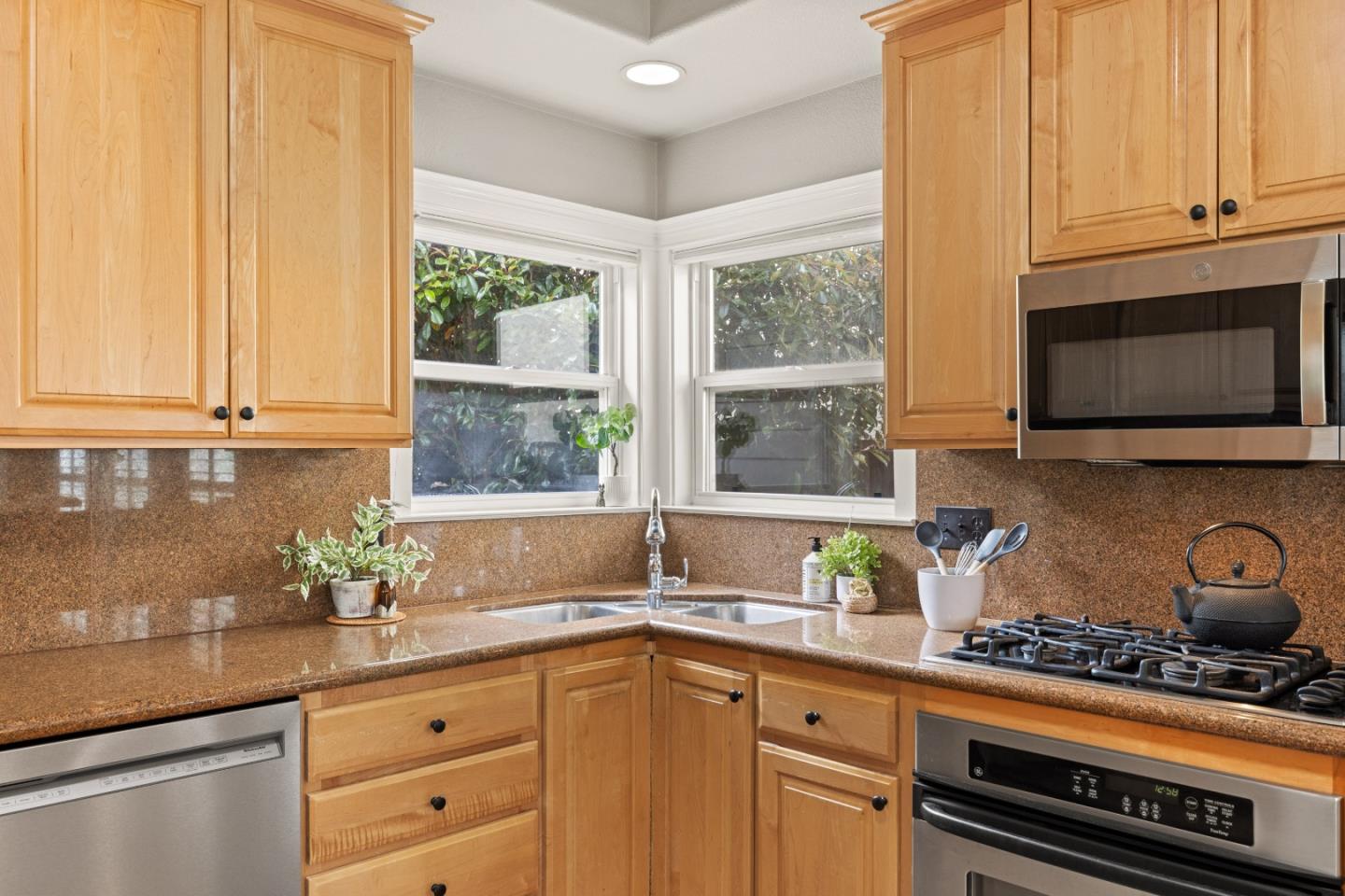 2549 Colonial Circle Watsonville, CA 95076 - Photo 16 of 54 a kitchen with stainless steel appliances a sink a stove and a window
