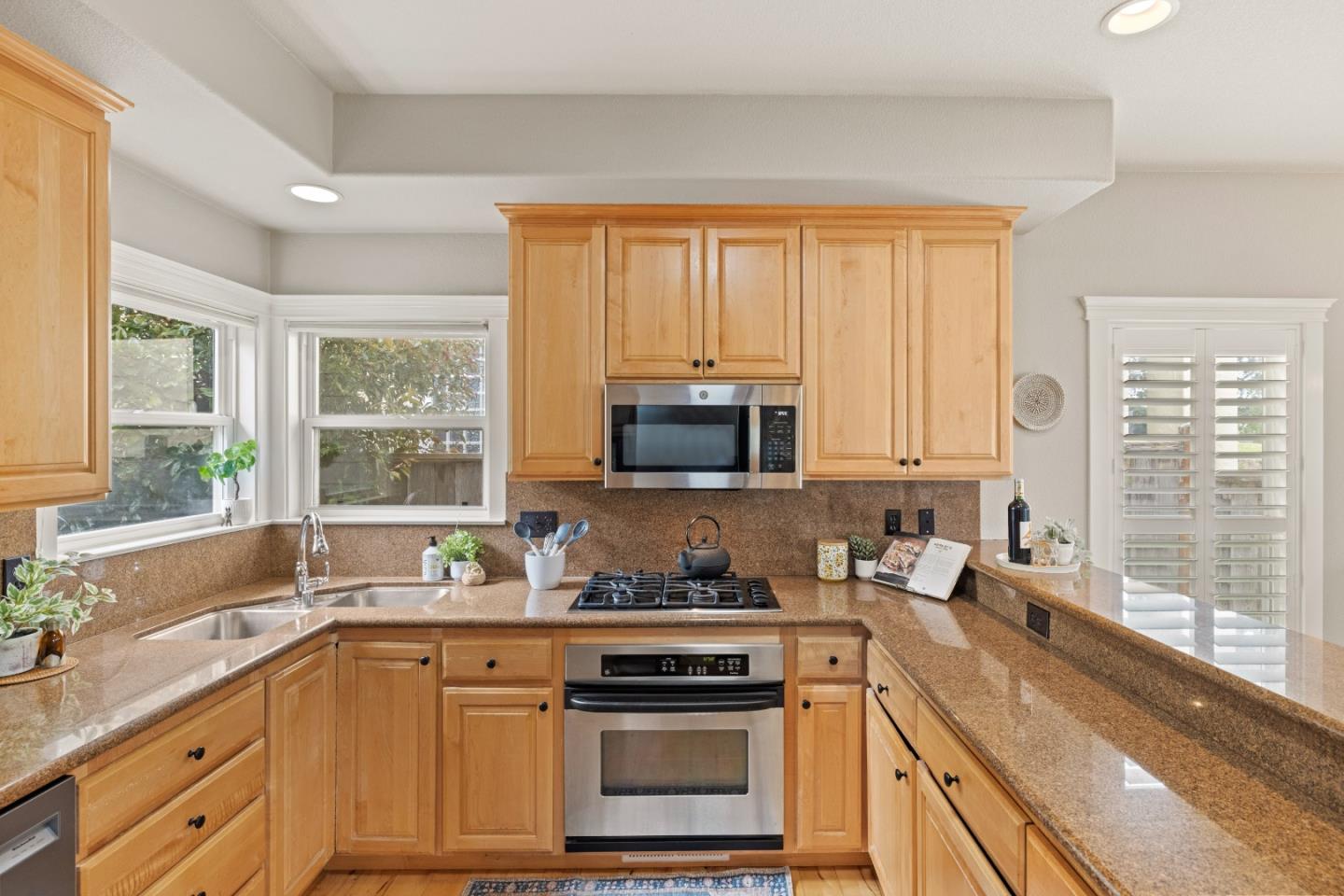2549 Colonial Circle Watsonville, CA 95076 - Photo 17 of 54 a kitchen with granite countertop a stove a sink and a granite counter tops