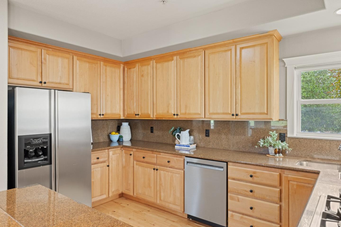 2549 Colonial Circle Watsonville, CA 95076 - Photo 19 of 54 a kitchen with stainless steel appliances granite countertop a refrigerator sink and cabinets