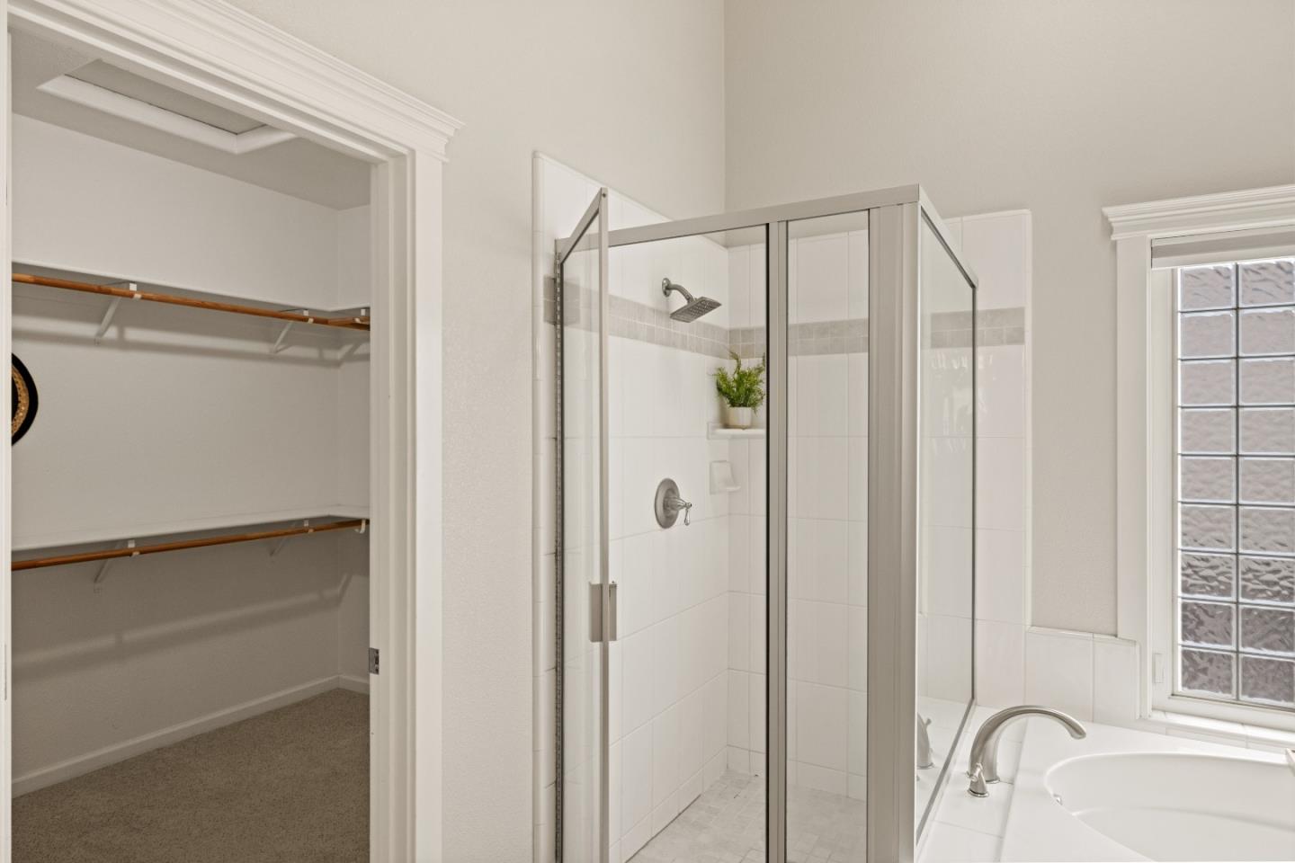 2549 Colonial Circle Watsonville, CA 95076 - Photo 29 of 54 a bathroom with a shower and a glass door