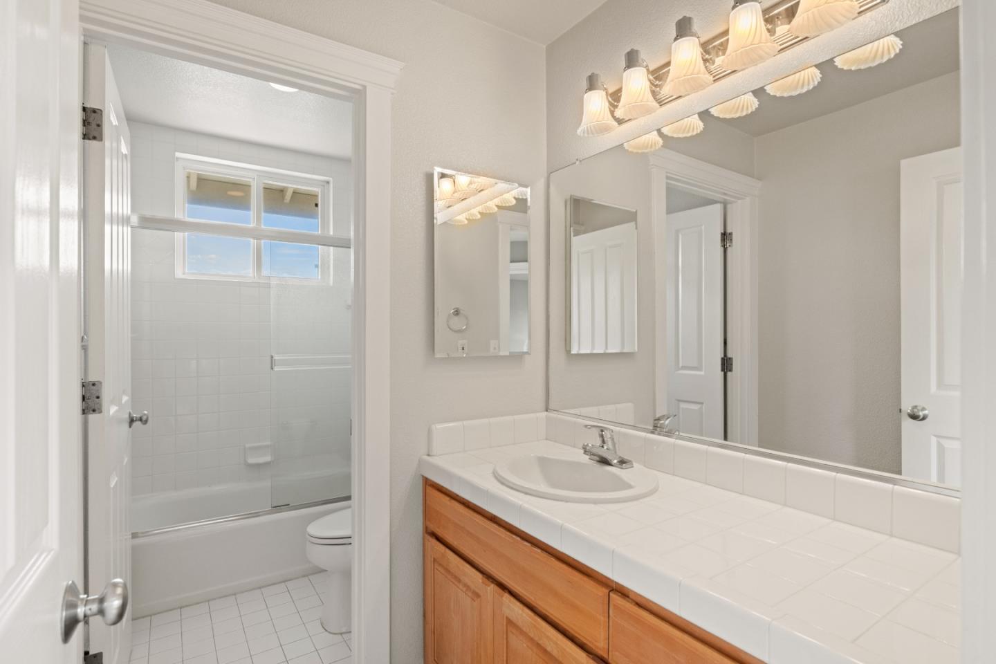 2549 Colonial Circle Watsonville, CA 95076 - Photo 33 of 54 a bathroom with a sink a toilet and a mirror