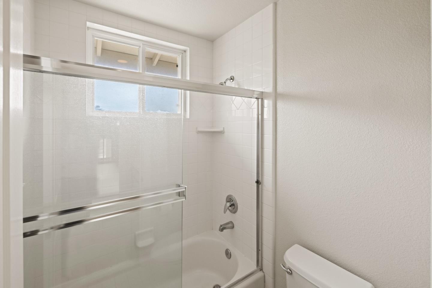 2549 Colonial Circle Watsonville, CA 95076 - Photo 34 of 54 a bathroom with a shower and toilet