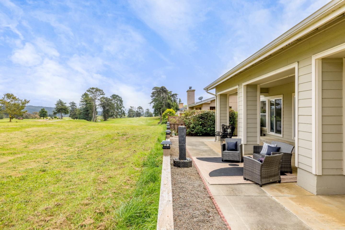 2549 Colonial Circle Watsonville, CA 95076 - Photo 46 of 54 a view of a patio with couches chairs and a floor to ceiling window