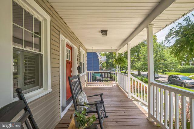 a view of a balcony with chairs