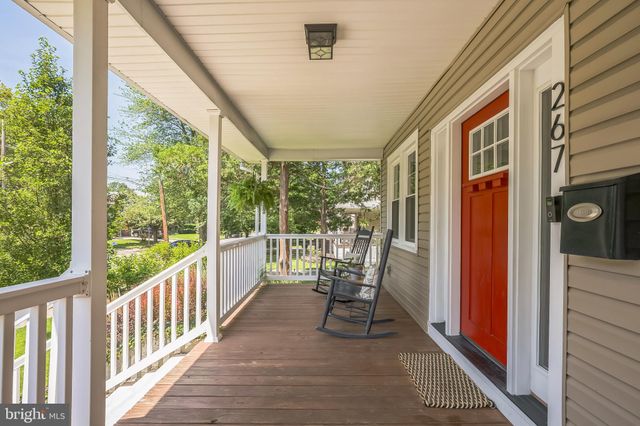 a view of a two chairs in the balcony