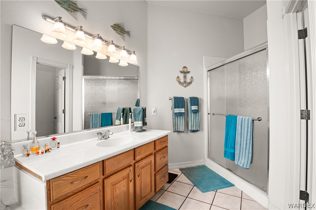 2898 Mountain Trail Road Kingman, AZ 86401 - Photo 17 of 75 a bathroom with a sink vanity and a mirror