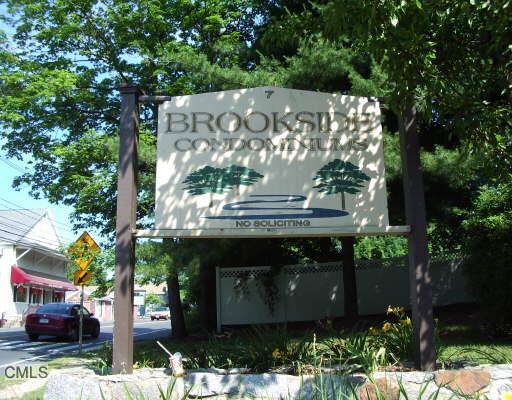 7 Padanaram Road, Unit 133 Danbury, CT 06811 - Photo 1 of 1 a sign that is sitting in the middle of a park
