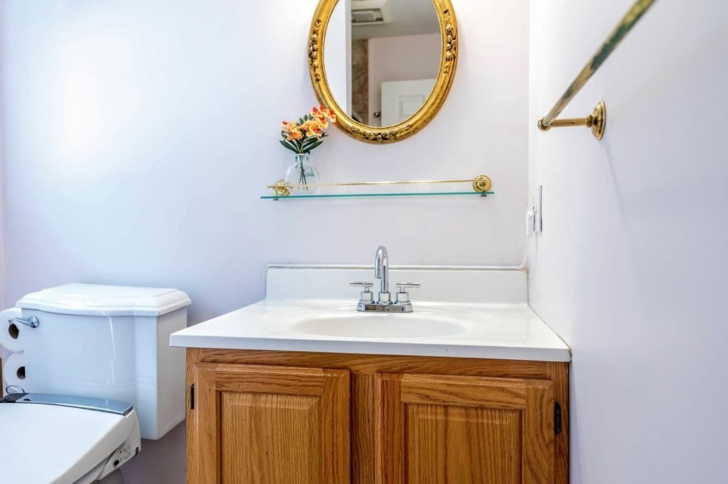8 Spinney Path Lynn, MA 01902 - Photo 11 of 42 a bathroom with a sink and a mirror