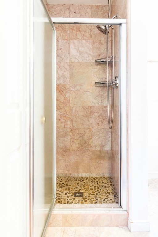8 Spinney Path Lynn, MA 01902 - Photo 12 of 42 a bathroom with a glass shower door