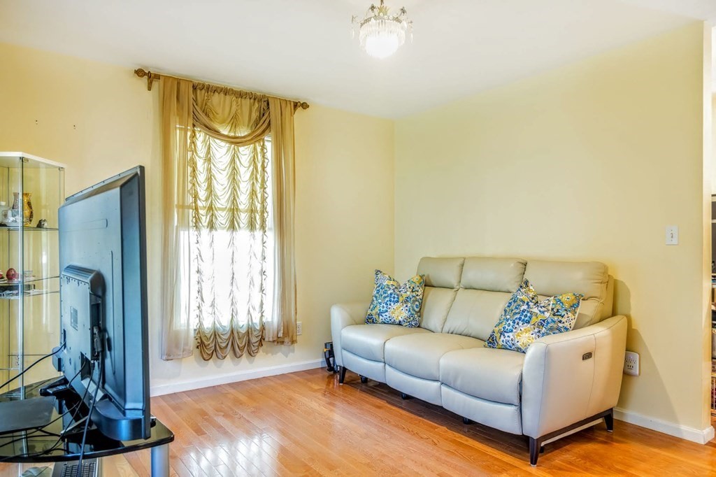 8 Spinney Path Lynn, MA 01902 - Photo 13 of 42 a living room with furniture and a flat screen tv